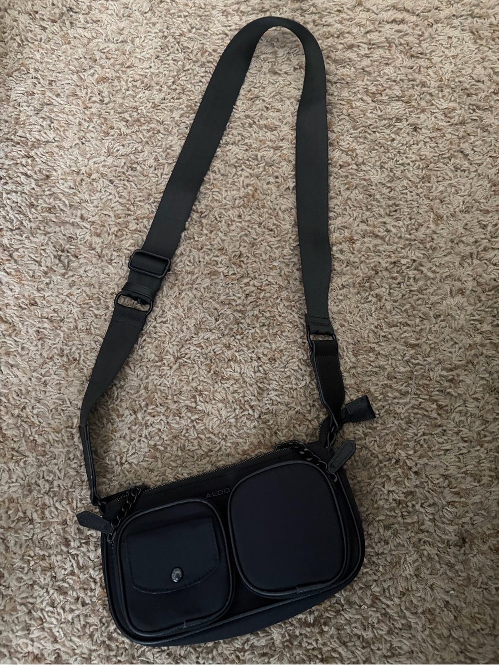 Also black crossbody bag